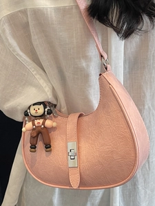Pink crescent moon shoulder bag with pleated faux leather and cartoon girl charm