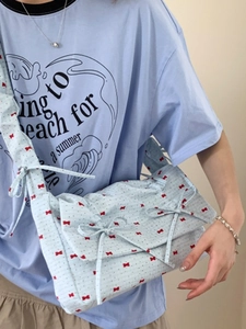 Sweet light blue floral fabric shoulder bag with red bow print and 3D ribbon accents