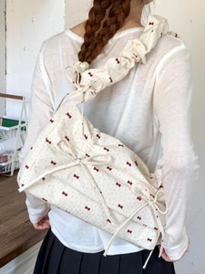 Floral cream fabric shoulder bag with red bows and ruffled strap for summer fashion