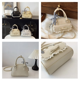Detail view of shell bags with lace trim, leather bows, and ribbon-wrapped handles