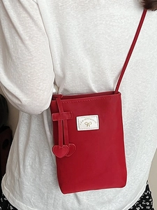 Minimalist red nylon phone crossbody bag with heart pendant and white leather logo tag