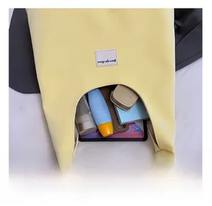 Interior view of yellow velvet tote bag showing high capacity for tablets and cosmetics