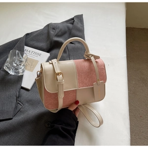Detail of color-block mini square bag with beige leather and pink suede textures