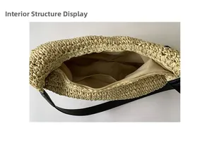 Internal structure of woven beach bag featuring zip closure and black wide shoulder strap