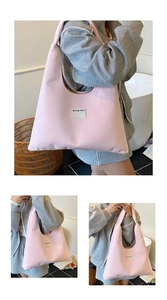 Pink waterproof nylon tote bag with text patch detail and large capacity structure