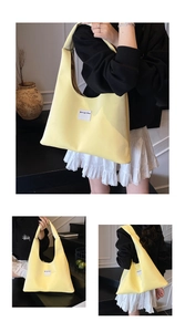 Lemon yellow velvet tote bag showing hand-held and shoulder-carry styles in home setting