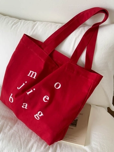 Red high-capacity canvas tote bag with white artistic letters for casual daily fashion