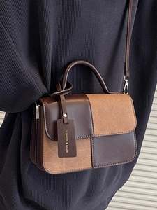 Two-tone retro leather handbag with contrast stitching and multi-layer gusset design