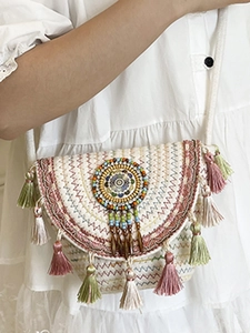 Bohemian woven crossbody bag with colorful bead embroidery and tiered fringe tassels