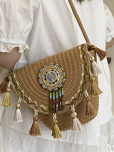 Bohemian handwoven crossbody bag with fringe, mandala bead badge and geometric embroidery