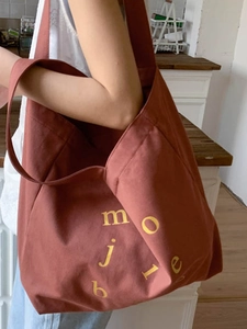 Large capacity brick red canvas tote bag with yellow letters for daily commuting