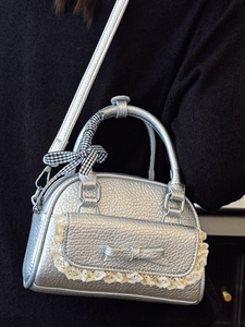 Silver metallic shell bag with lace bow and plaid scarf detail for stylish women