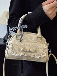 Beige lychee leather shell bag with lace trim and bow ribbon handle for women