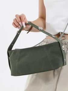 Olive green suede baguette bag with large silver rivets and elegant metal chain strap
