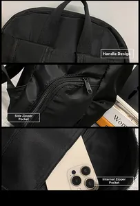 Detail view of reinforced handle, side hidden zip pocket, and internal storage compartment