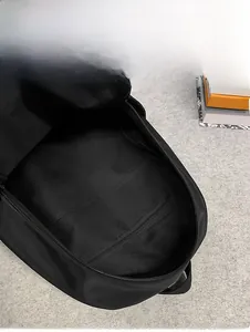 Internal capacity display of the black backpack showing the main compartment and zip pocket