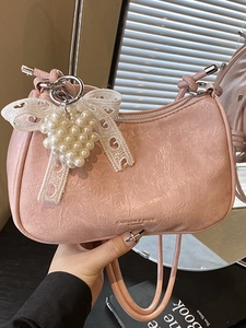 Pink pleated cloud shoulder bag with heart pearl bow charm and logo detail