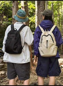 Waterproof nylon backpack shown in forest setting, highlighting lightweight outdoor design