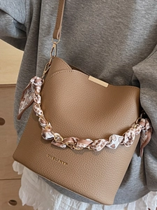 Caramel brown bucket bag with silk scarf handle and gold chain for women's daily commute