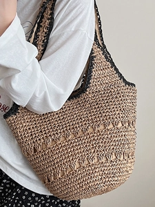 Straw hollow shoulder bag with large capacity and black trim for beach vacation