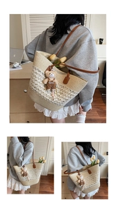 Detail of straw tote bag with brown leather straps and cute teddy bear pendant
