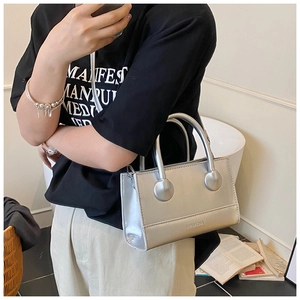 Detail view of a silver minimalist PU leather handbag with embossed Tiancha logo and strap