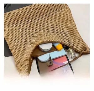 Detailed internal capacity of woven tote bag showing space for tablet and makeup