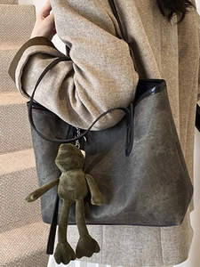 Large charcoal grey tote bag with vintage wash texture and green plush frog charm
