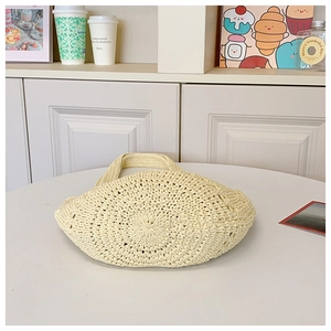 Detailed close-up of ivory woven texture on this bohemian hollow crochet handbag
