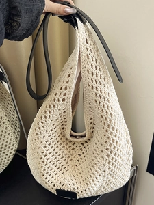 Large capacity beige knit tote bag with black leather straps and magnetic closure