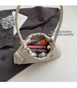 Detail view of woven shoulder bag interior showing large capacity for essentials