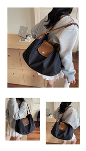 Three-way view of large nylon tote bag with contrasting brown faux leather straps