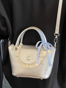Silver pleated metallic crossbody bag with lace trim and blue checkered bow handle