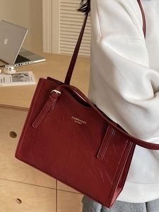 Vintage burgundy large capacity leather tote bag with gold logo and adjustable straps