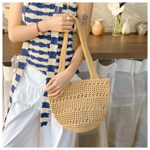 Close-up of khaki mesh woven tote bag showing detailed cotton rope hollow knit pattern
