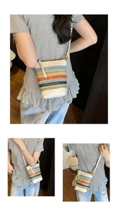 Detail der bunten Regenbogenstreifen und cremefarbenen Lederbesätze der Eimertasche