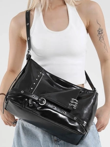 Street punk style black glossy tote bag with silver metal eyelets and wide shoulder strap
