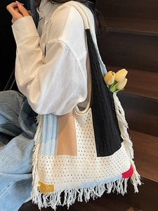 Bohemian knit tote bag with colorful patchwork, fringe details, and large capacity