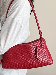 Elegant red woven leather shoulder bag for women with minimalist baguette style design