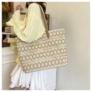 Chic hollow paper rope woven tote bag with brown leather straps for summer beach style