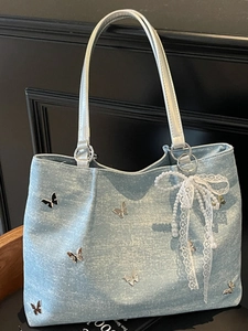 Light blue glitter tote bag with silver butterfly charms and elegant pearl lace bow