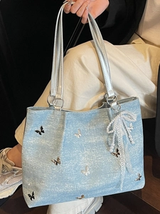 Light blue tote bag with metallic butterfly accents and pearl lace charm for women