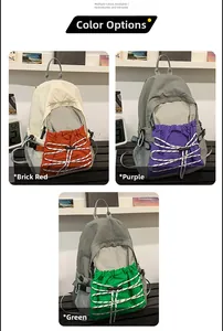 Detailed comparison of outdoor backpacks in brick red, purple, and green with bungee cords