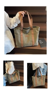 Detail of army green canvas tote bag with brown fabric straps and front pocket