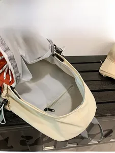 Macro view of spacious internal capacity with a zippered pocket in the beige travel backpack