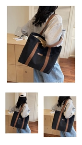 Detail view of large canvas tote bag showing side pocket and durable brown leather straps