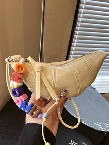 Minimalist beige croissant bag with pleated design and colorful CHOSMU letter beads