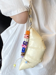 Chic beige croissant crossbody bag with colorful alphabet beads on minimalist strap