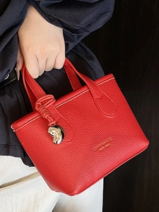 Stylish red lychee pattern leather bucket tote bag with heart charm and top handles