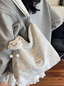Quilted canvas tote bag with colorful embroidery, large capacity and cloud pendant